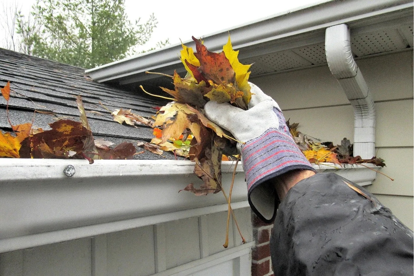 Cleaning debris out of a home gutter